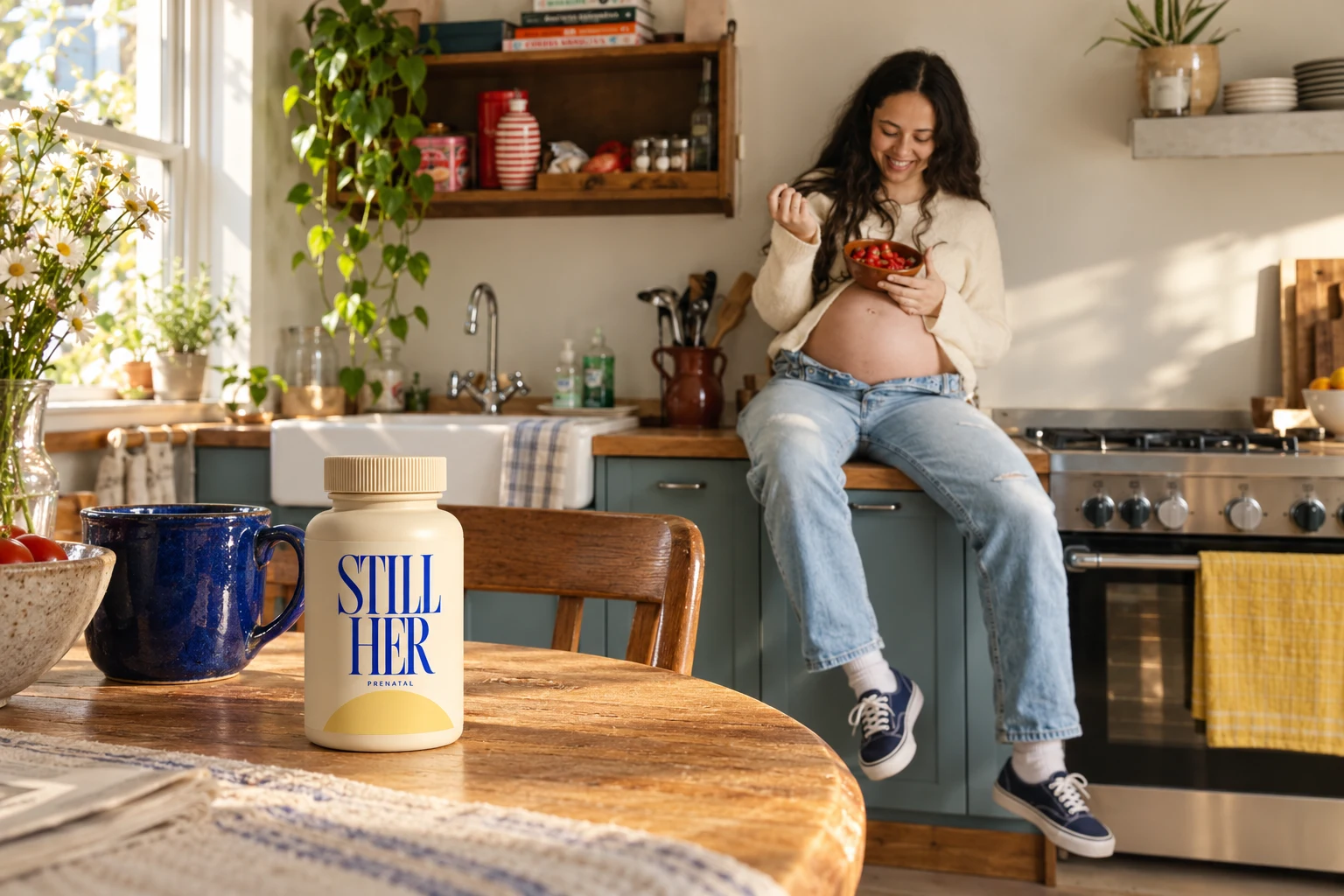 STILL HER prenatal bottle beside a blue mug, with a woman in sneakers enjoying breakfast in the kitchen
